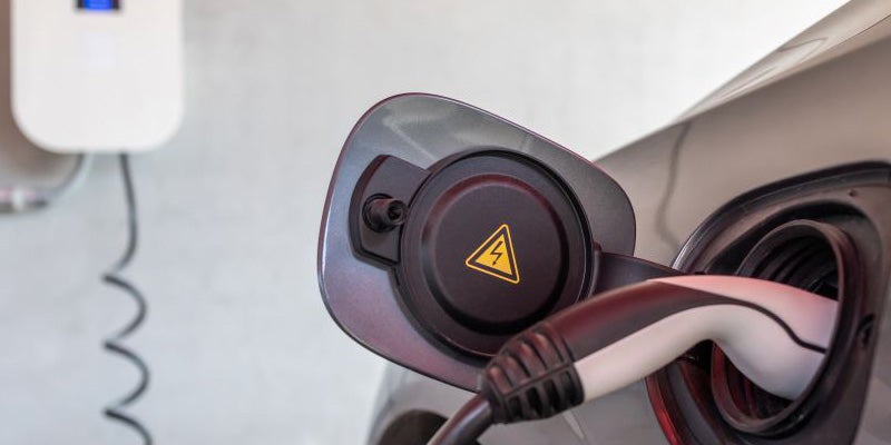 an ev charger plugged into a vehicle