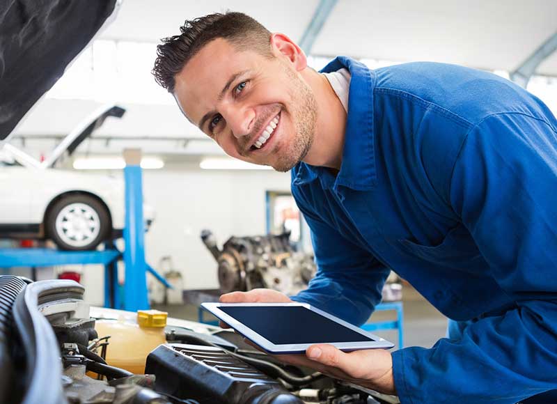 A mechanic inspecting an engine