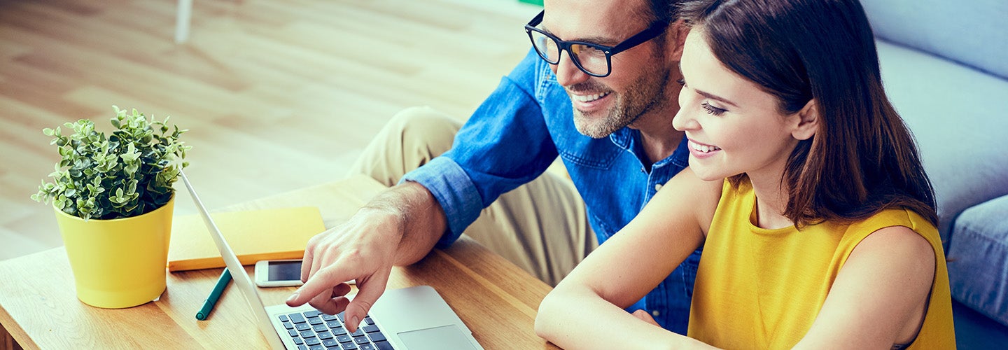 A person reviewing a CARFAX vehicle history report